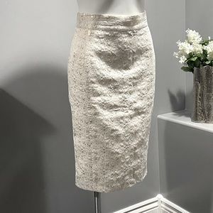 Beautiful cream pencil skirt with gold detailing.